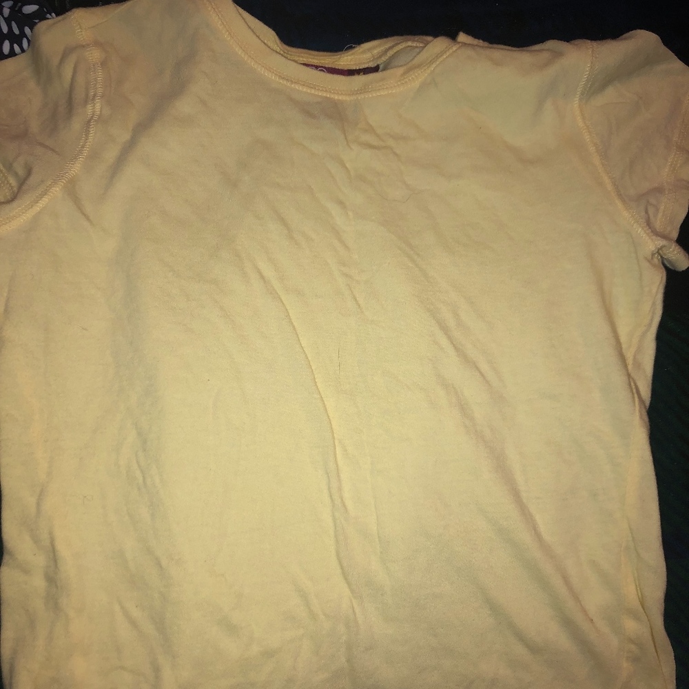 Yellow form fitting shirt